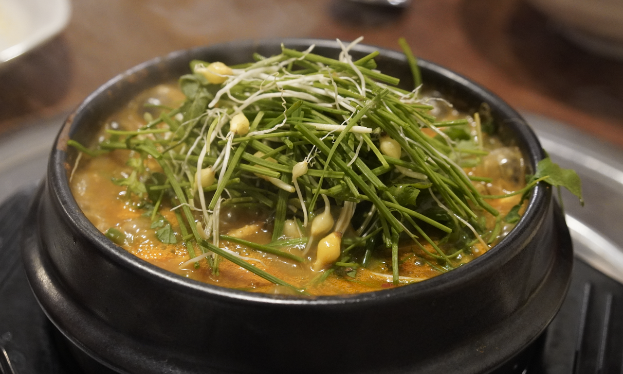 Dampuk Gyodae thick soybean paste stew beside charcoal-grilled meat