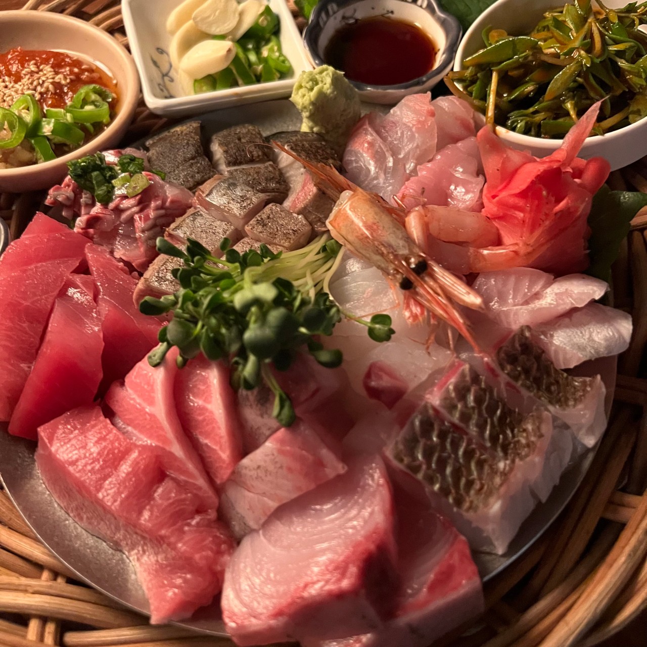 Retro-lit counter with aged sashimi at Maljillo