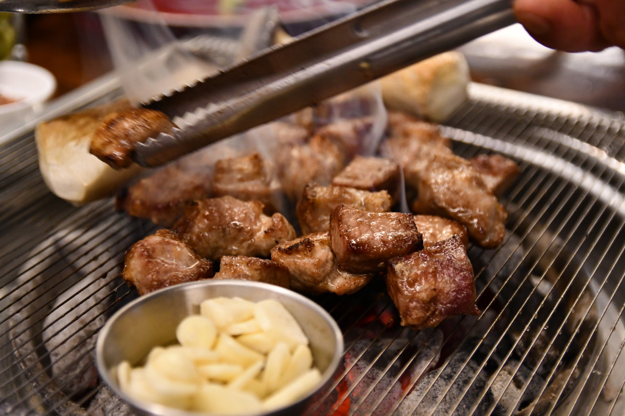 Googi grill with premium aged Korean beef sizzling
