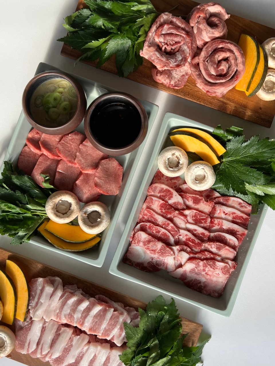 Haeyuldam custom iron grill over charcoal with unique pork and beef cuts