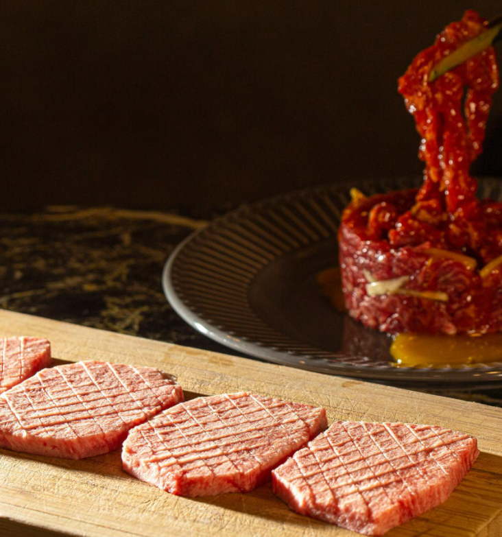 Miu selection of premium Korean beef cuts on the grill