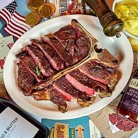 NOPS Hannam steak and pasta on wood table