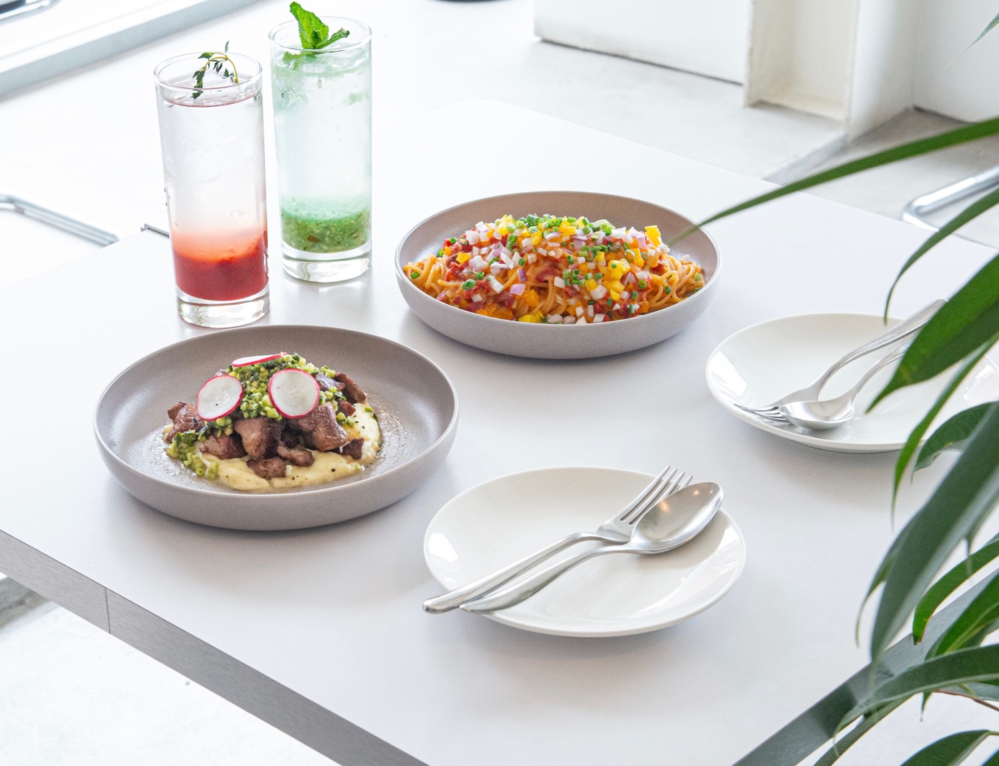 Langt Yeonnam window seats with plates of Asian-European dishes