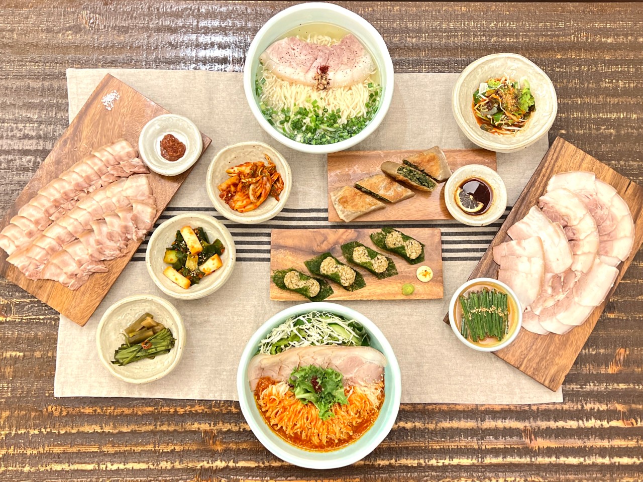Handmade noodles lifted from steaming meat soup at Jeongdeunmyeon