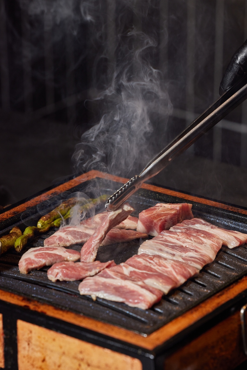 Jikhwa Jangin Sinsa premium pork cuts on the grill