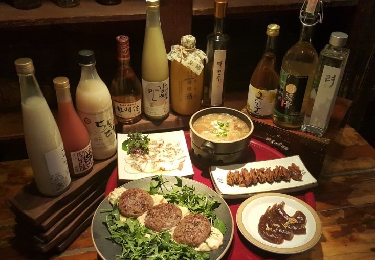Sanullim1992 shelves of Korean traditional liquors and cozy pub interior