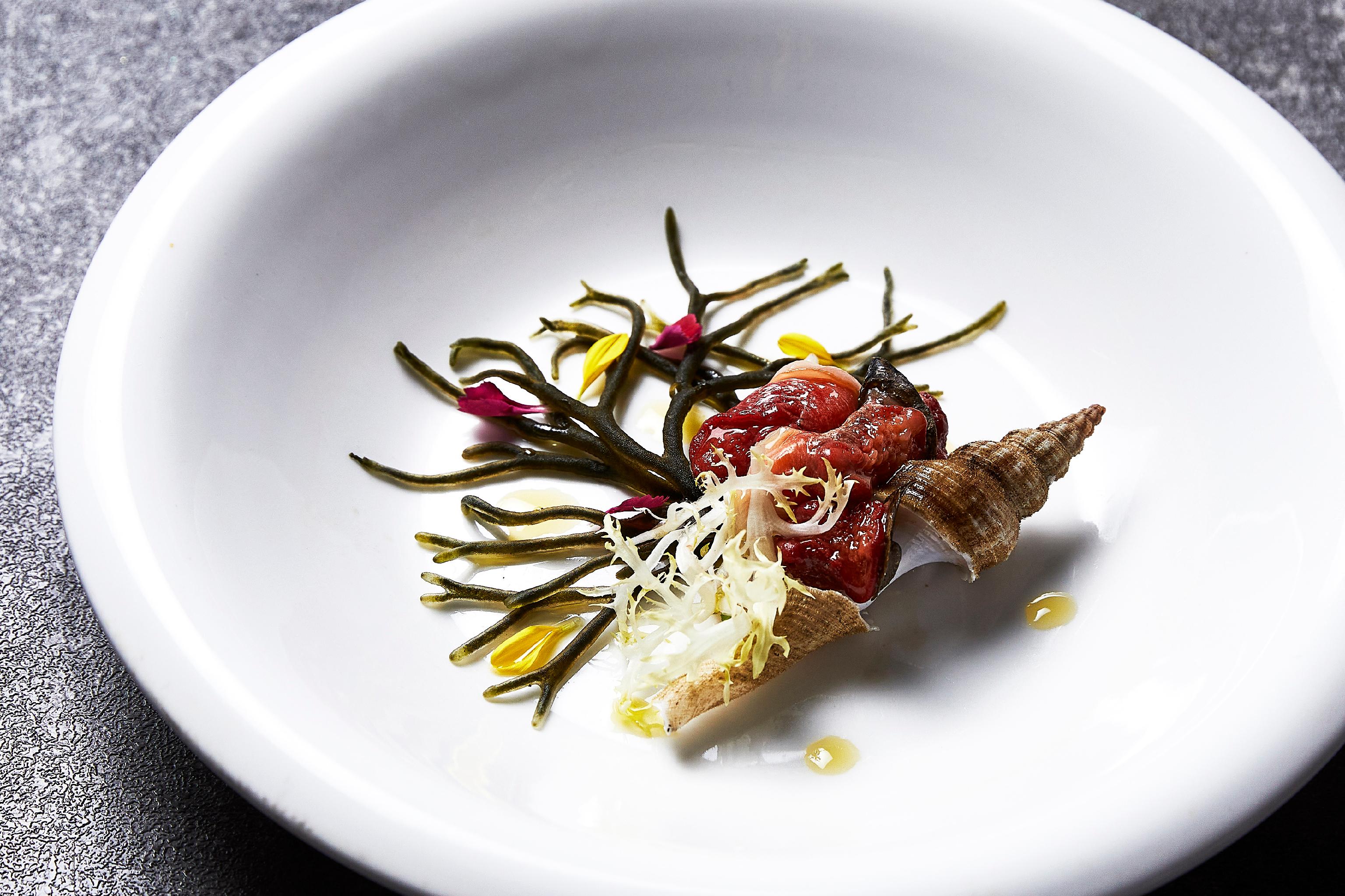 Chef Gon plating seafood with wine pairing near Jagalchi