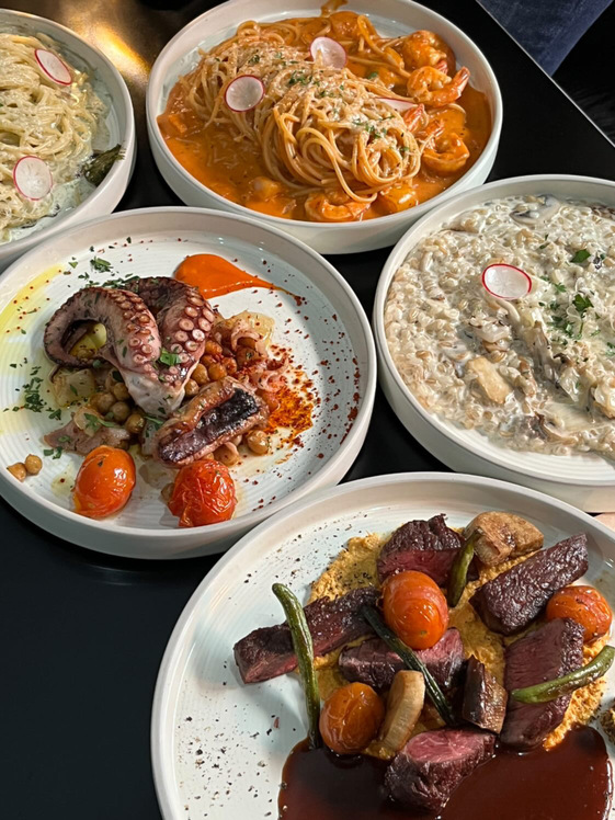 Dente Italian pasta and polpo dish plated neatly