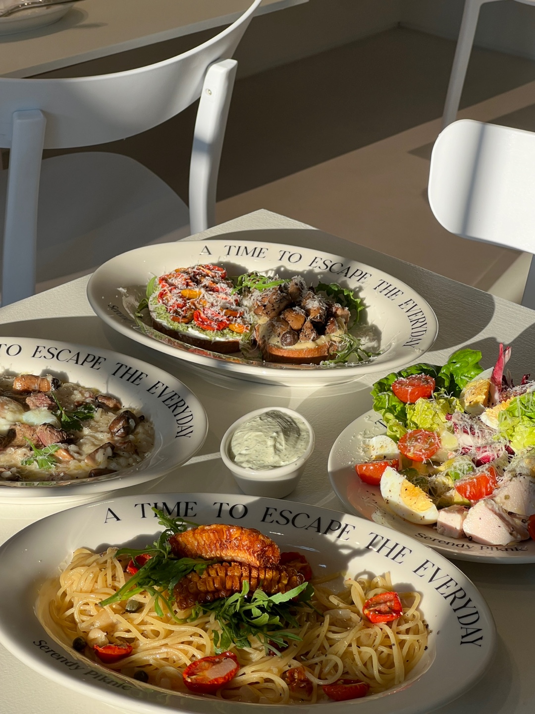 SERENDIPITY PICNIC sunlit brunch plates and flowers