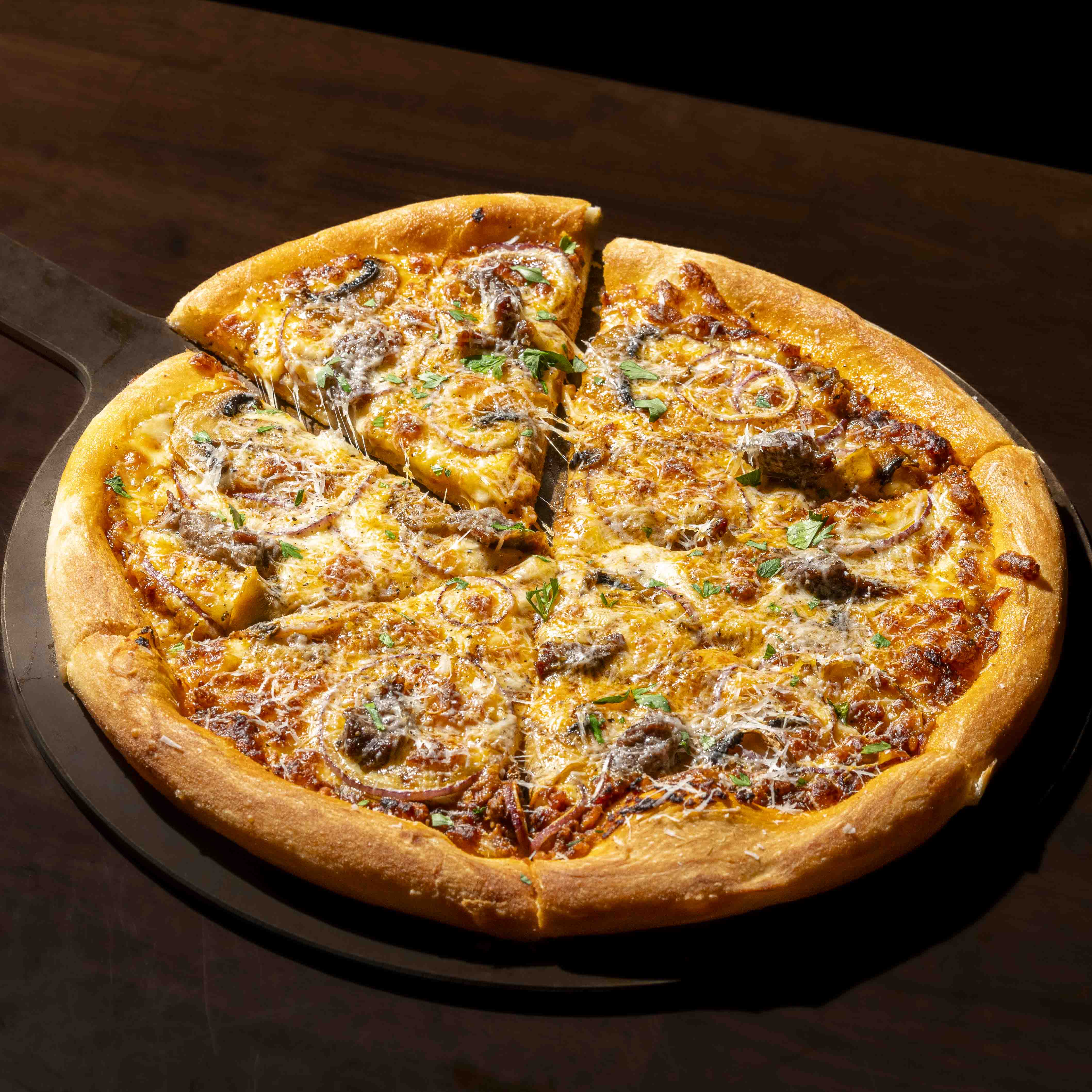 Ganhok occ warm-lit dining room with hearty pasta and wine glasses