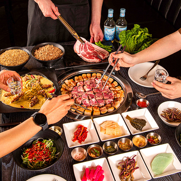 Jeju Seasoning black pork grilling over premium charcoal