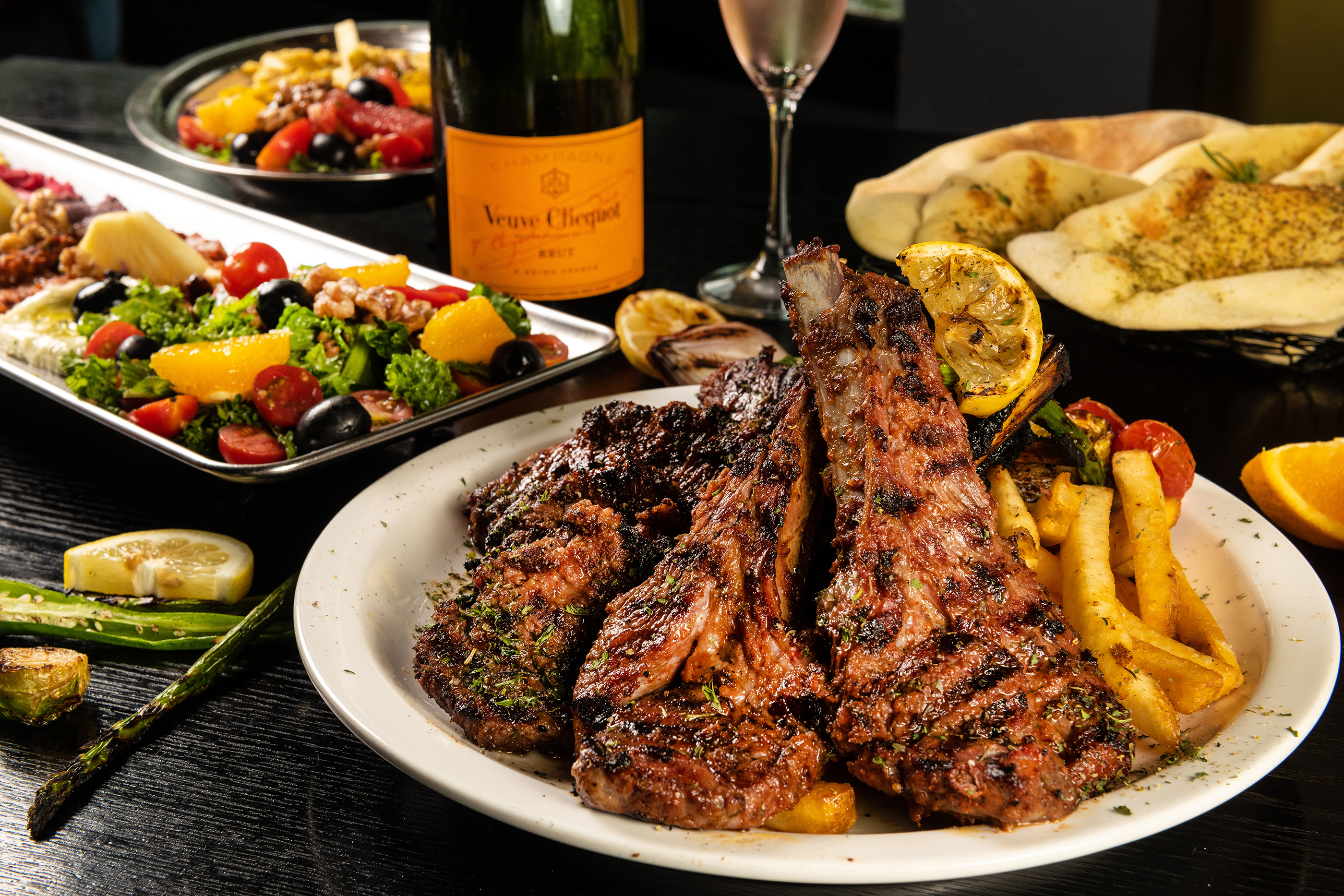 GRILLDOHA charcoal grilled lamb steak with pita and mezze