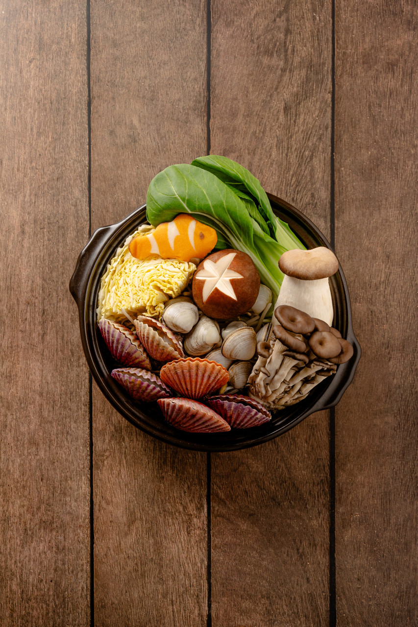 Otter's Den Korean hot pot and pancake on wooden table