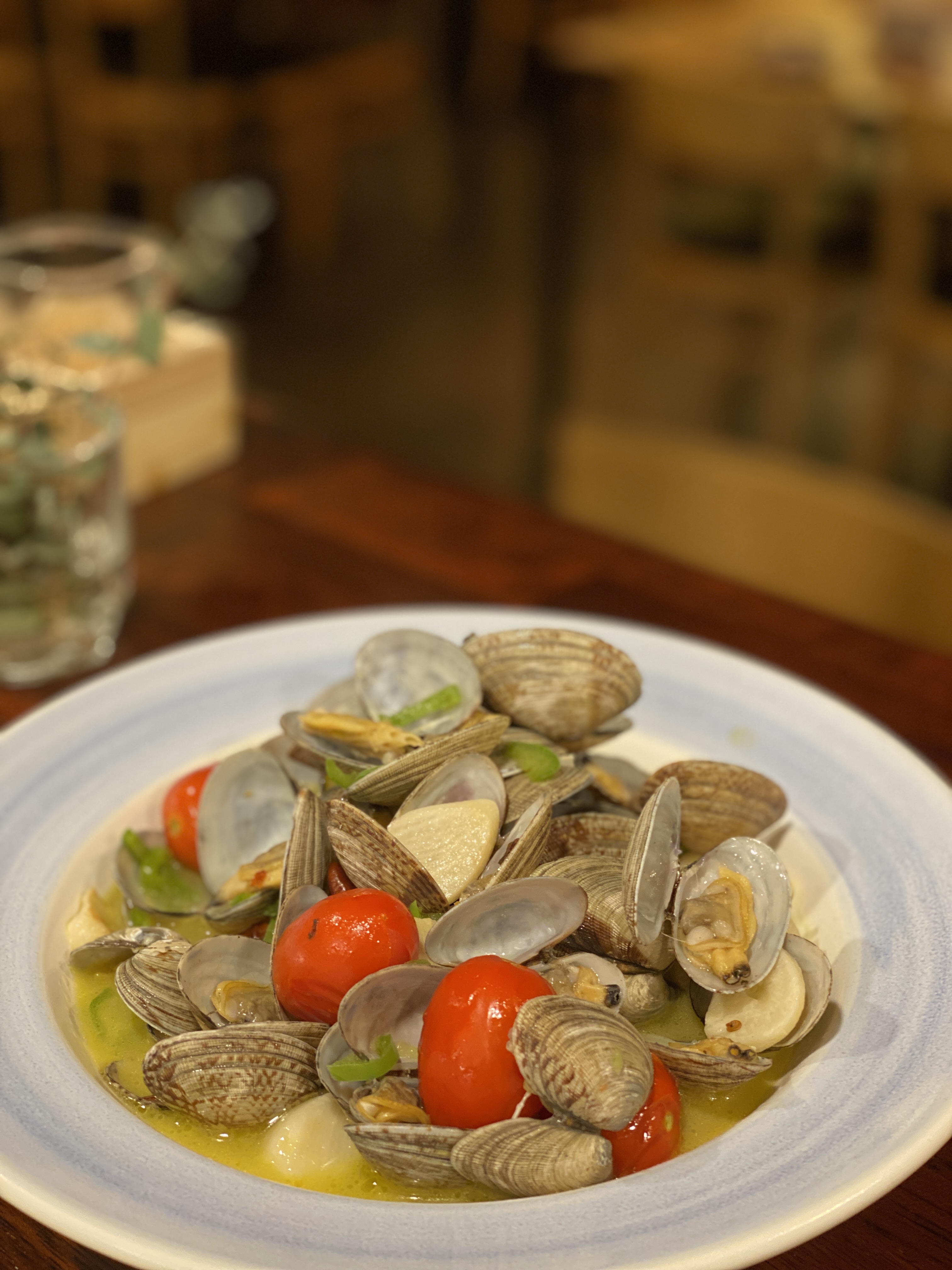 Longtail Paradise cozy izakaya counter with sake and wine