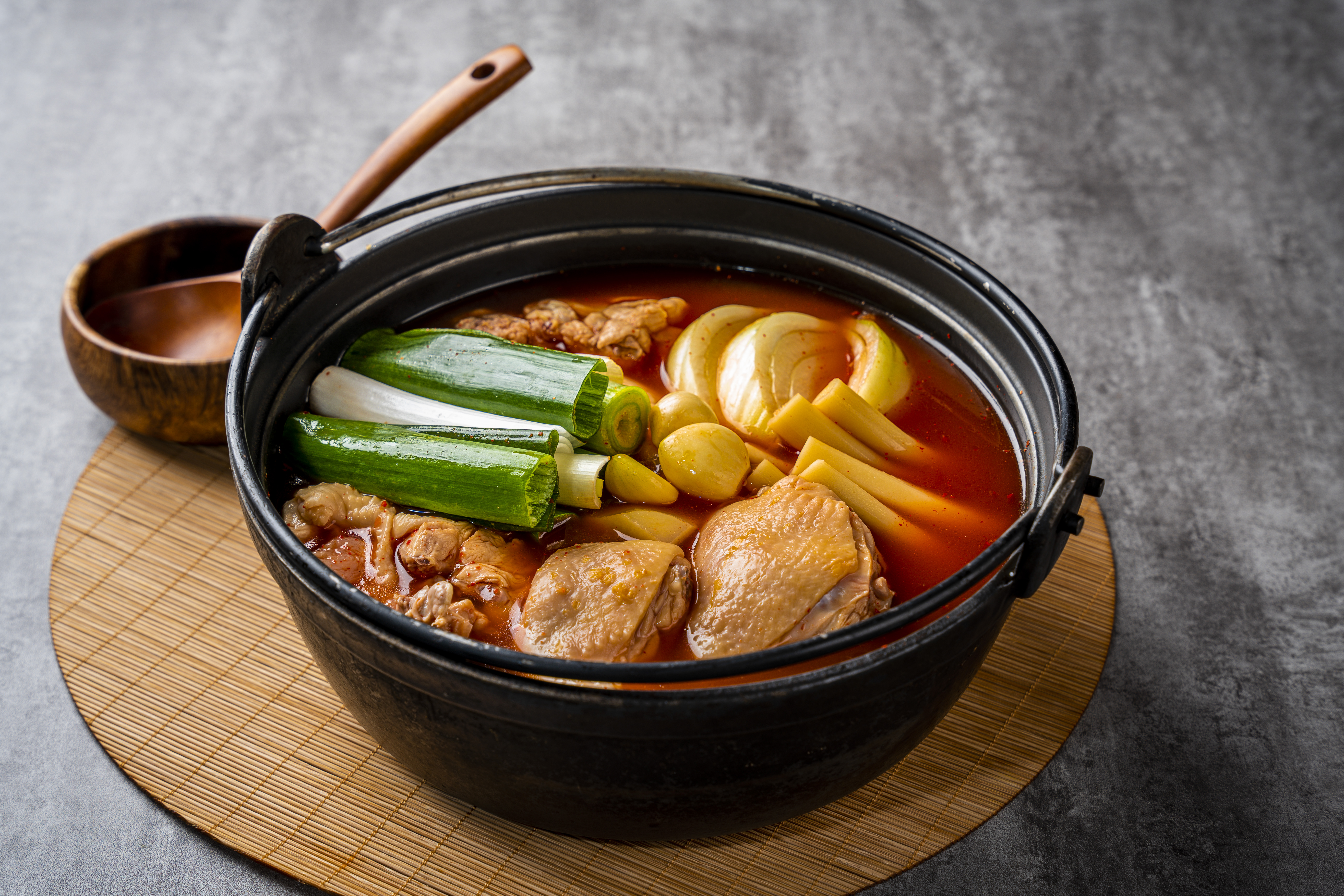 Waryongdong Spicy Chicken Stew with hearty broth and side dishes