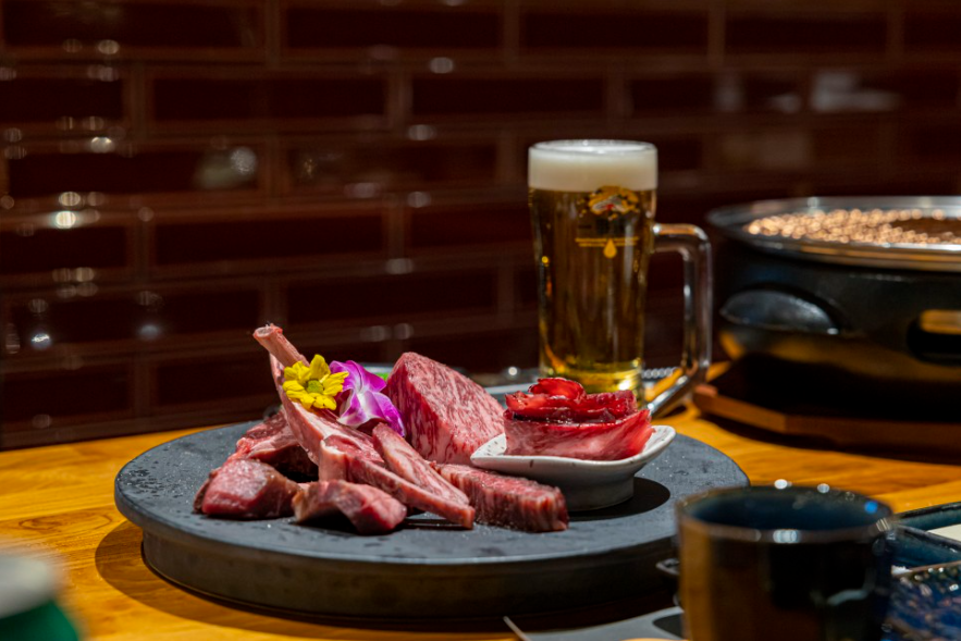 Sinsa Yanggalbi with lamb ribs and beef over the grill