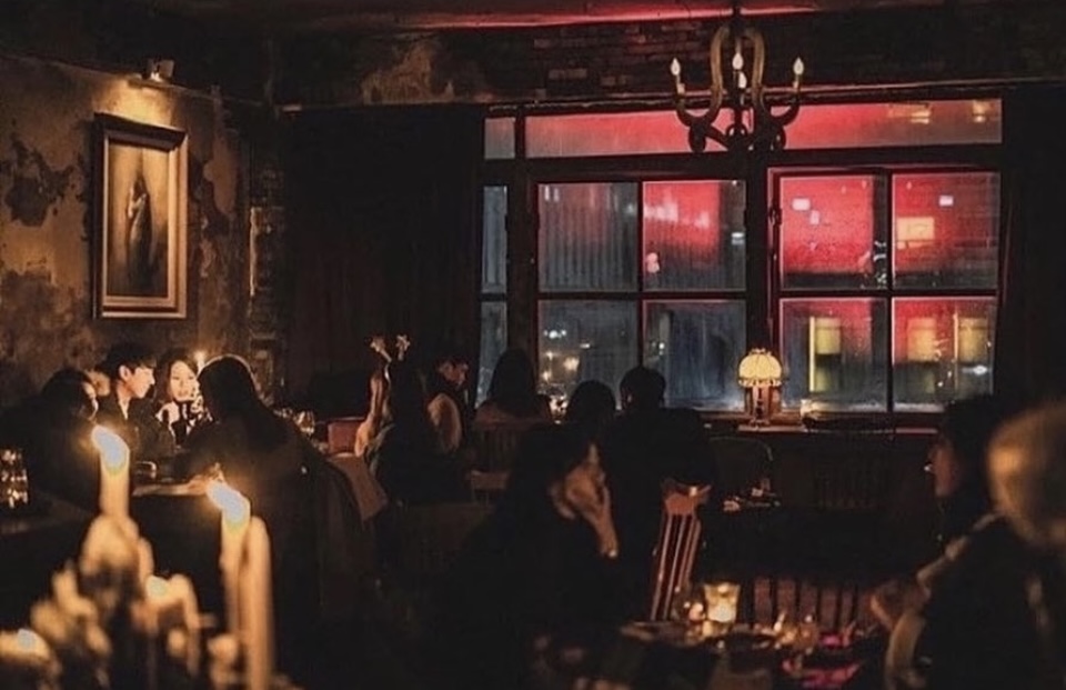 Rooftop view at 59 Stairs Wine Bar with city lights