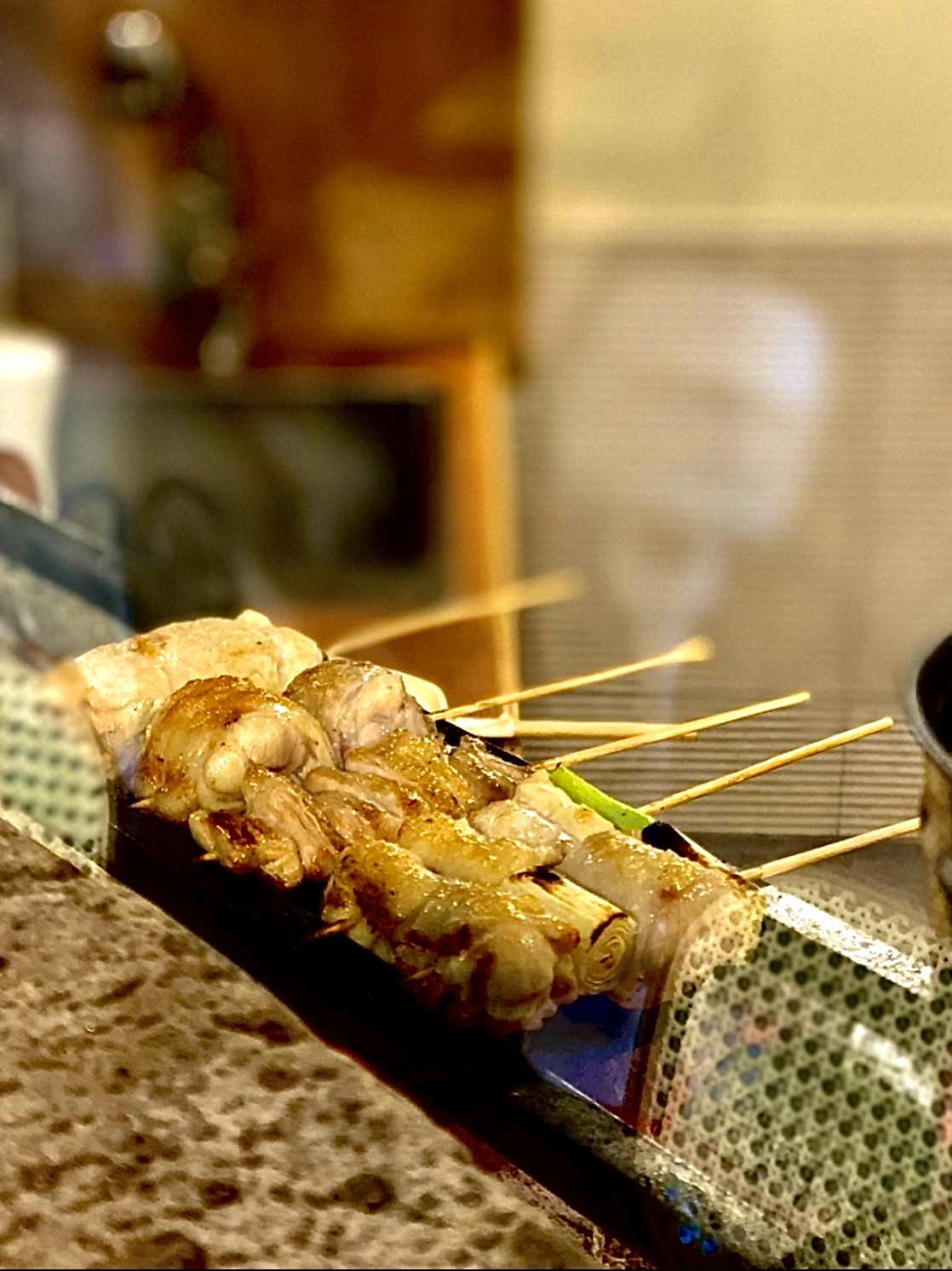 Yakitori Natsu skewers and chilled beer in a quiet alley