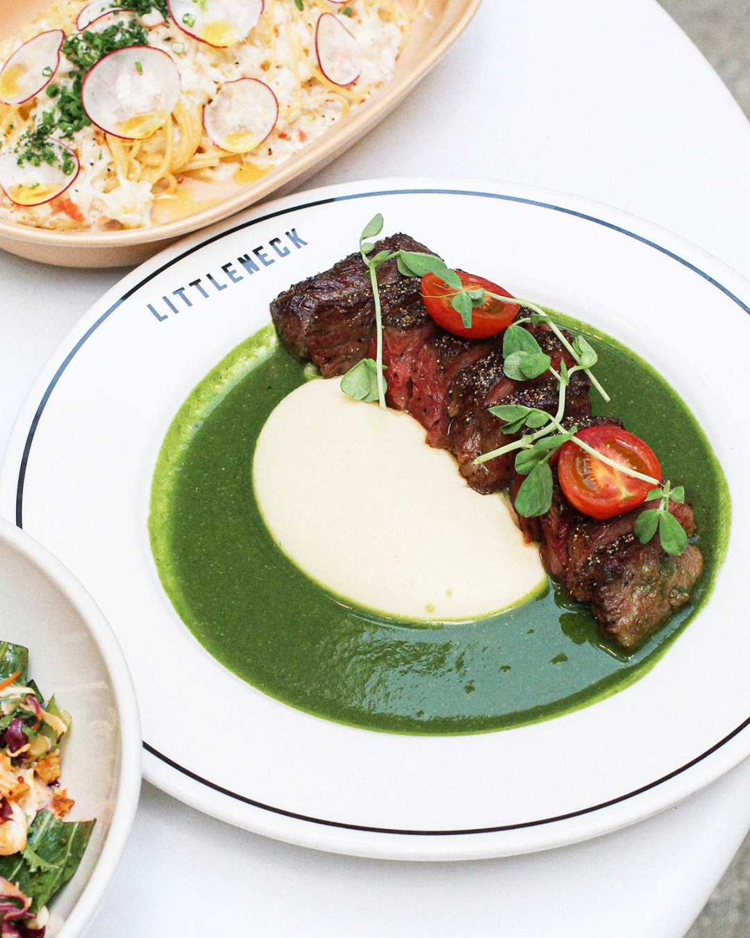 Little Neck Hannam sunny brunch table with greens and grains