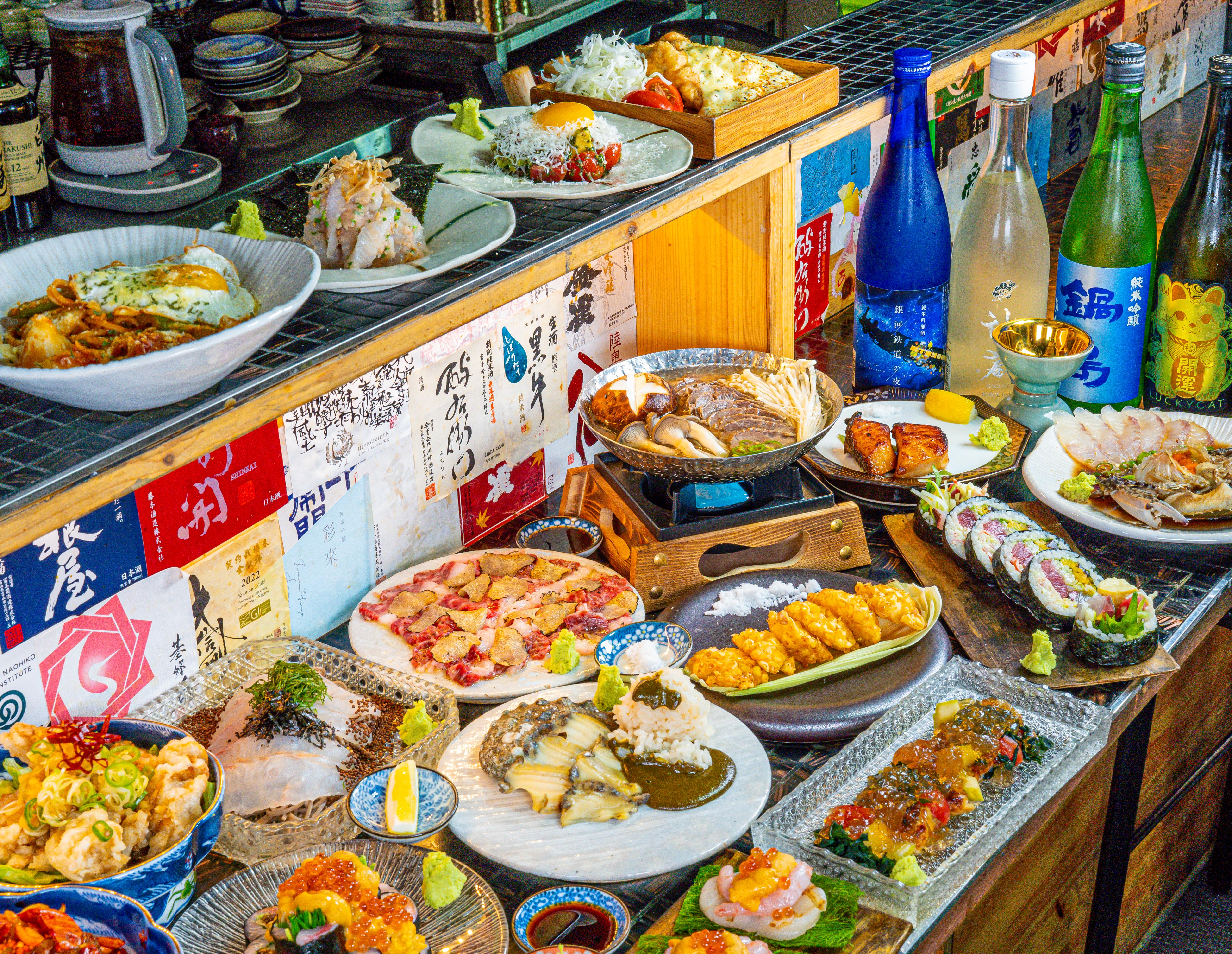Sake Bar Hitori counter with chilled bottles and small plates