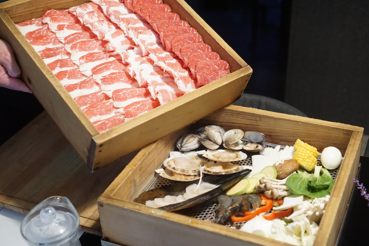 Dimly lit izakaya table at Churaumi Yeoksam