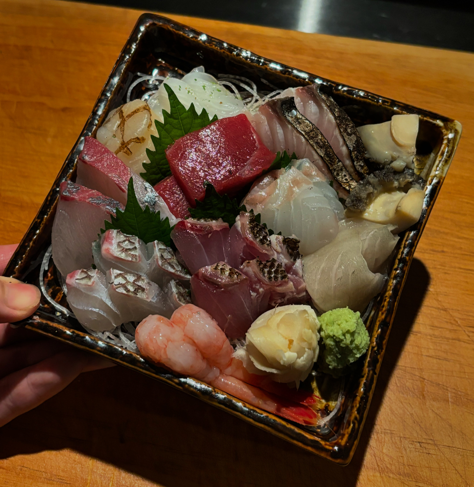 Izakaya Seonglib counter with sake and small plates near Mangwon Station