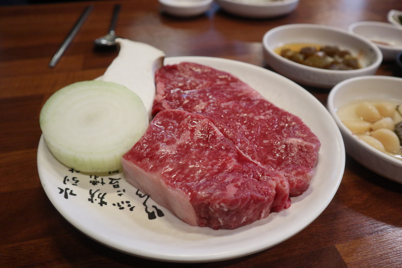 Cuts of low-temperature aged Hanwoo on a thick stone grill at City Hall
