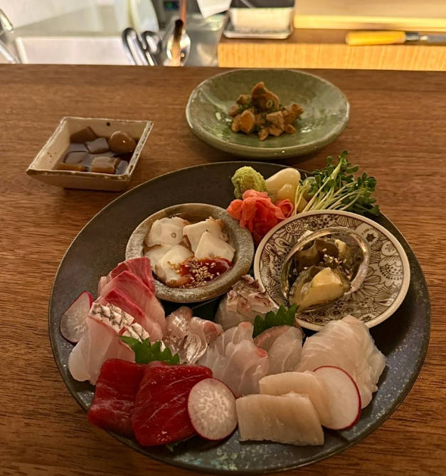 Samdong Late-Night Dining izakaya spread with ankimo maki and highballs