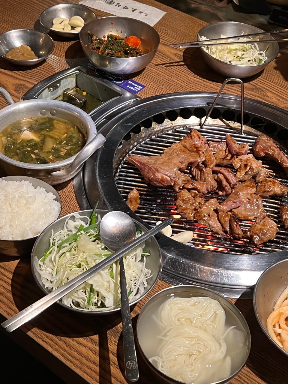 Chobakjib Mapo-style grilled pork ribs sizzling on a grate