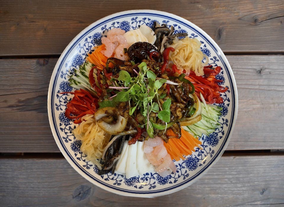 Wine poured beside hearty hot pot and steak in Gangnam