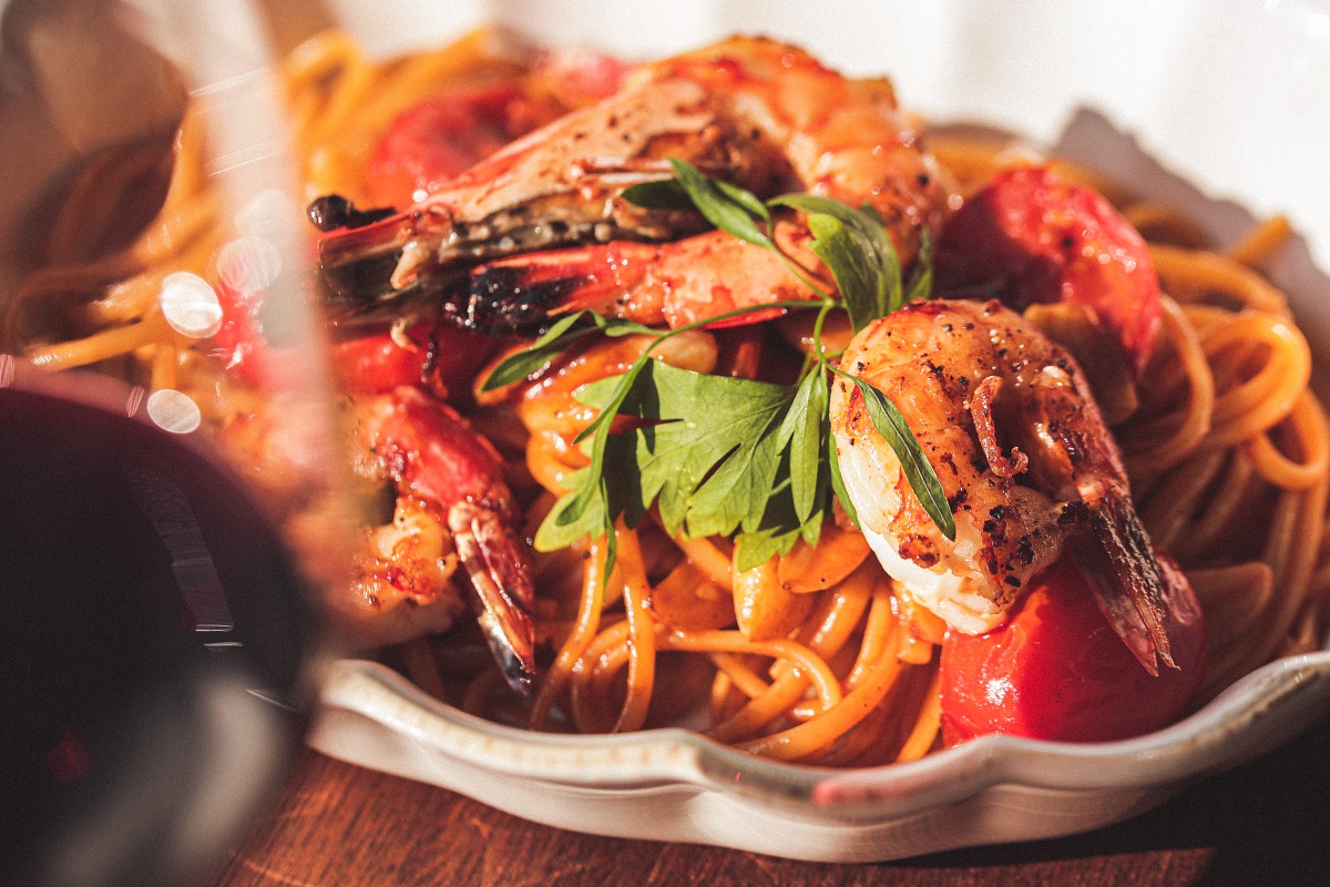 Sunlit brunch plates with octopus salad, steak, and pizza at Moltz Aewol