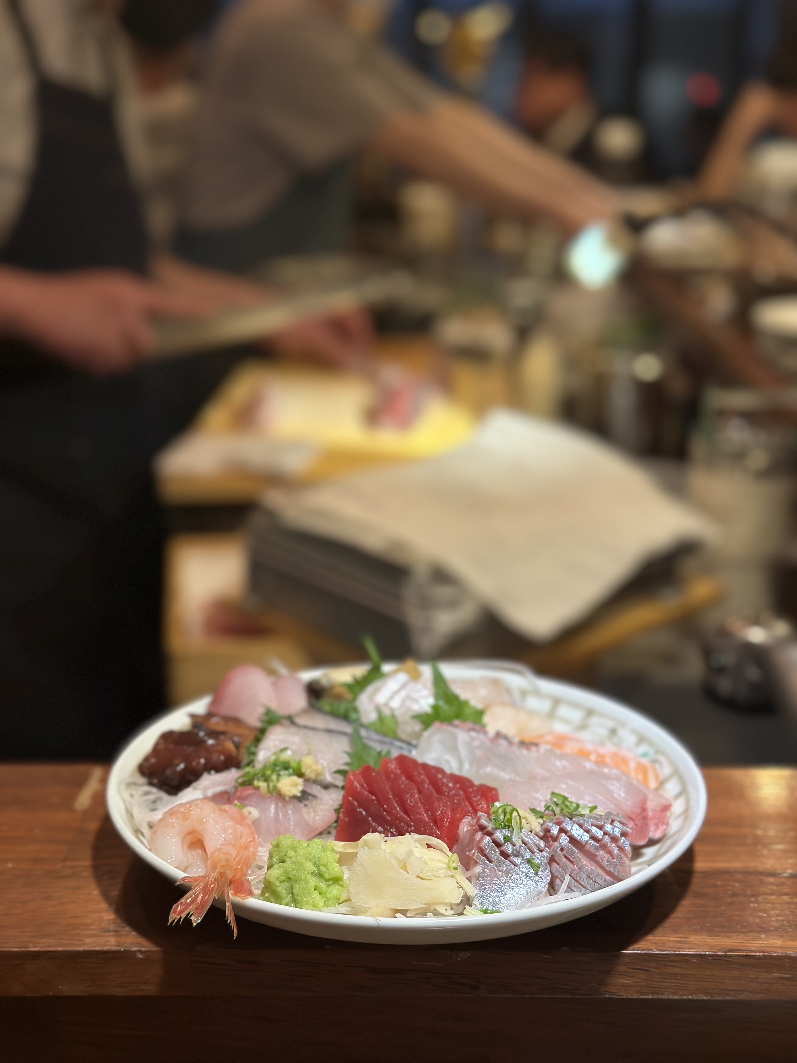 Asoto izakaya counter with sake and small plates in Hapjeong