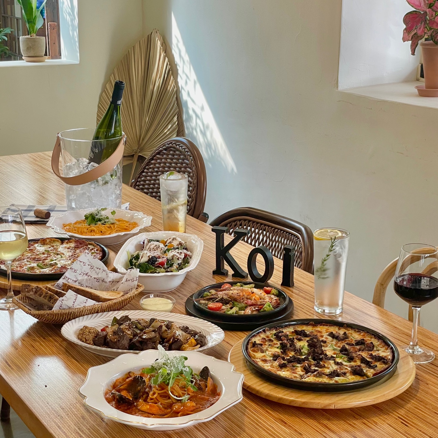 Koi Itaewon bistro plates with a tropical, Bali-inspired vibe