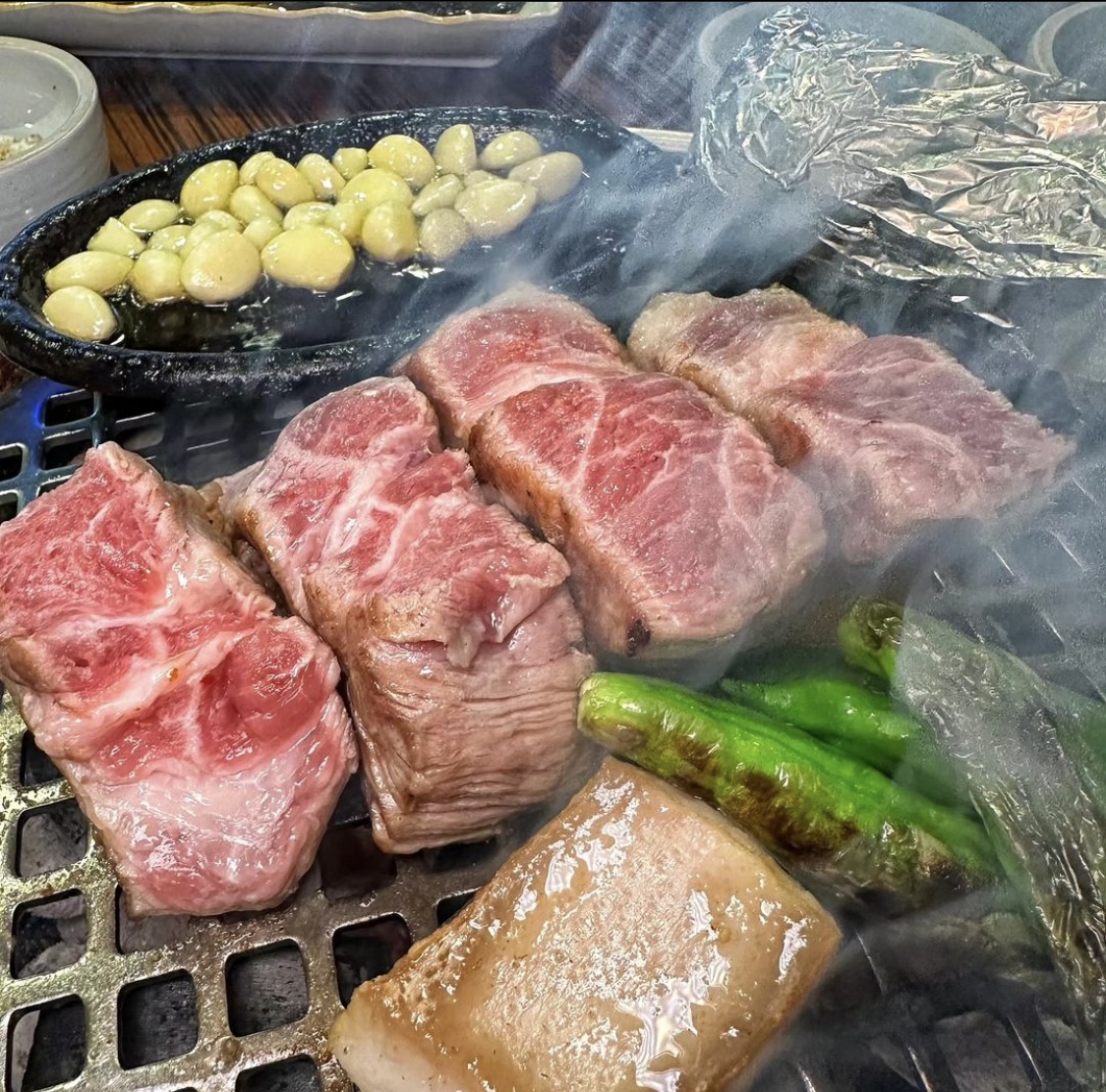 Charcoal grill at Dongraejeong with Jeju-style meljorim