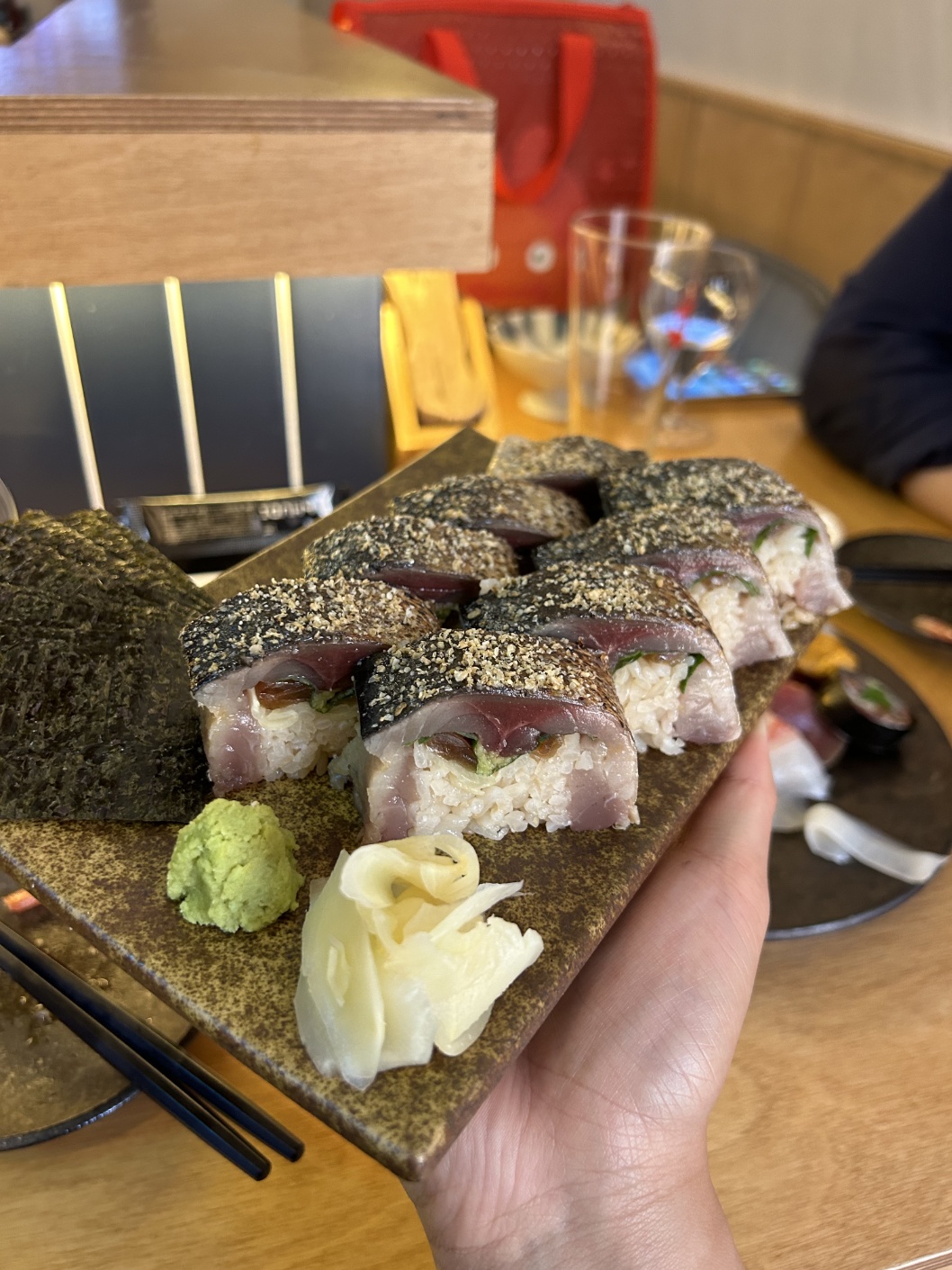 Kuzira Mokdong counter with sake and fried appetizers