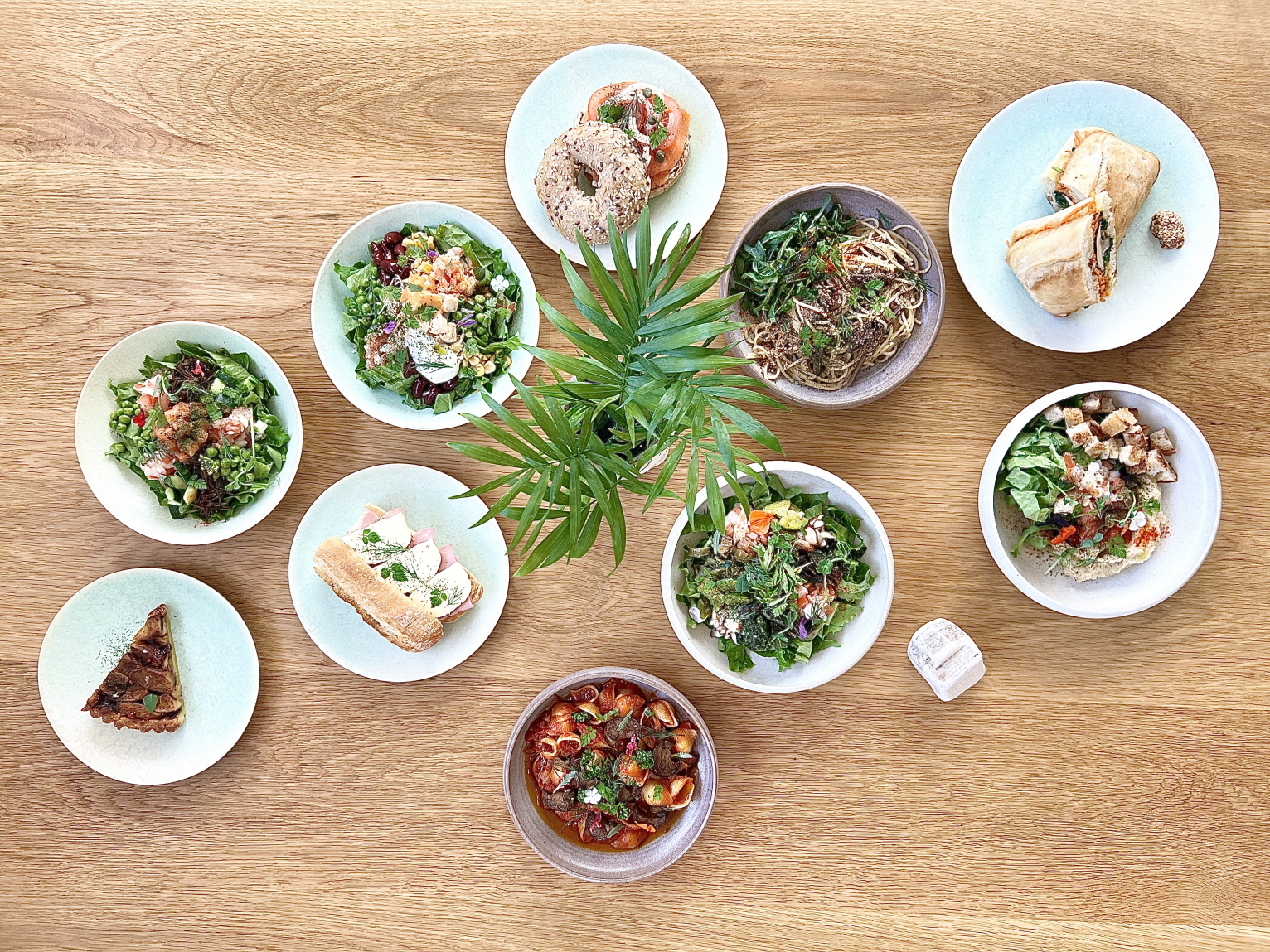 Refreshments—calm brunch table with seasonal greens and natural wine