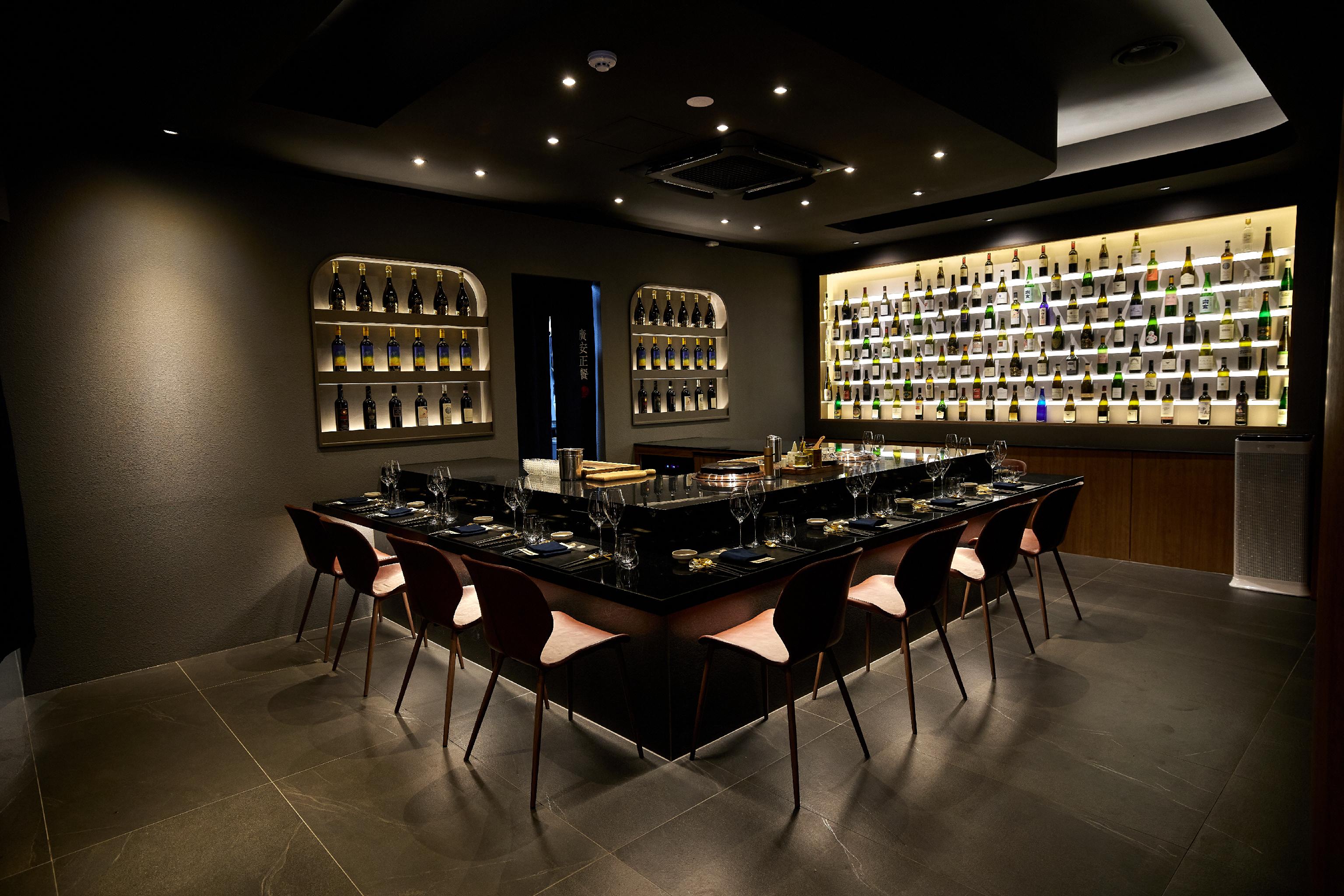 Gwangan Dining dimly lit wine dining room with ocean glimmers