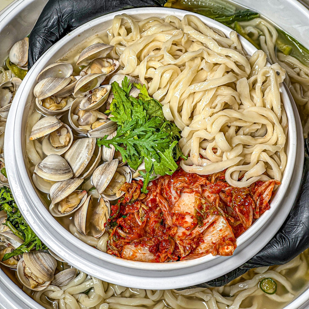 JoJoKalguksu’s seafood kalguksu and crispy jeon