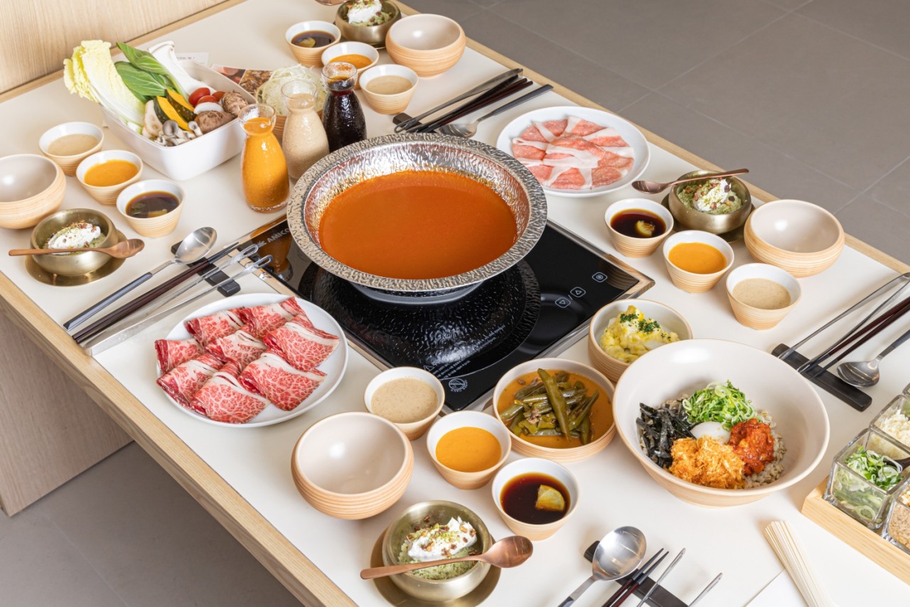 Shabu pot of Hanwoo-bone broth with vegetables and sauces at Obok Shabu