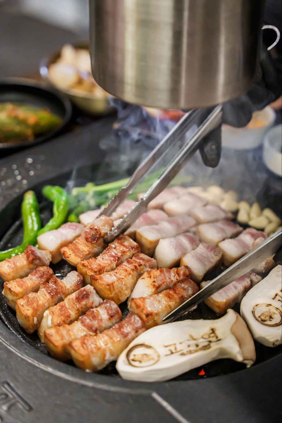 Gogiyeon aged pork with signature kimchi and five sauces