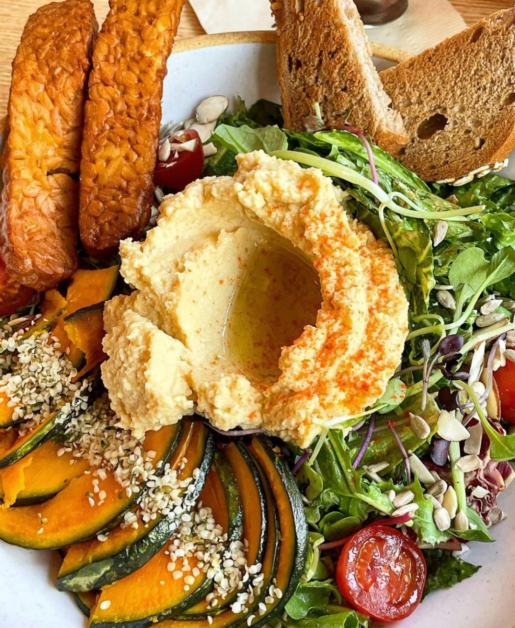 Plant Cafe Seoul vegan bowls and cakes in sunlit space