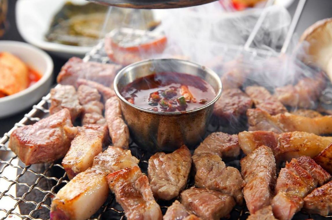 Heukdonga Myeongdong Jeju black pork sizzling on a grill
