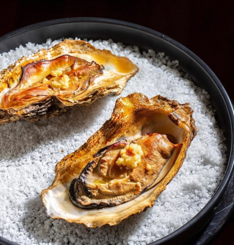 Yooyongwook BBQ Lab private dining with brisket and smokers