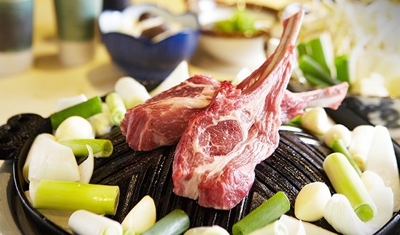 Ramuzin Cheongdam lamb chops being grilled by staff