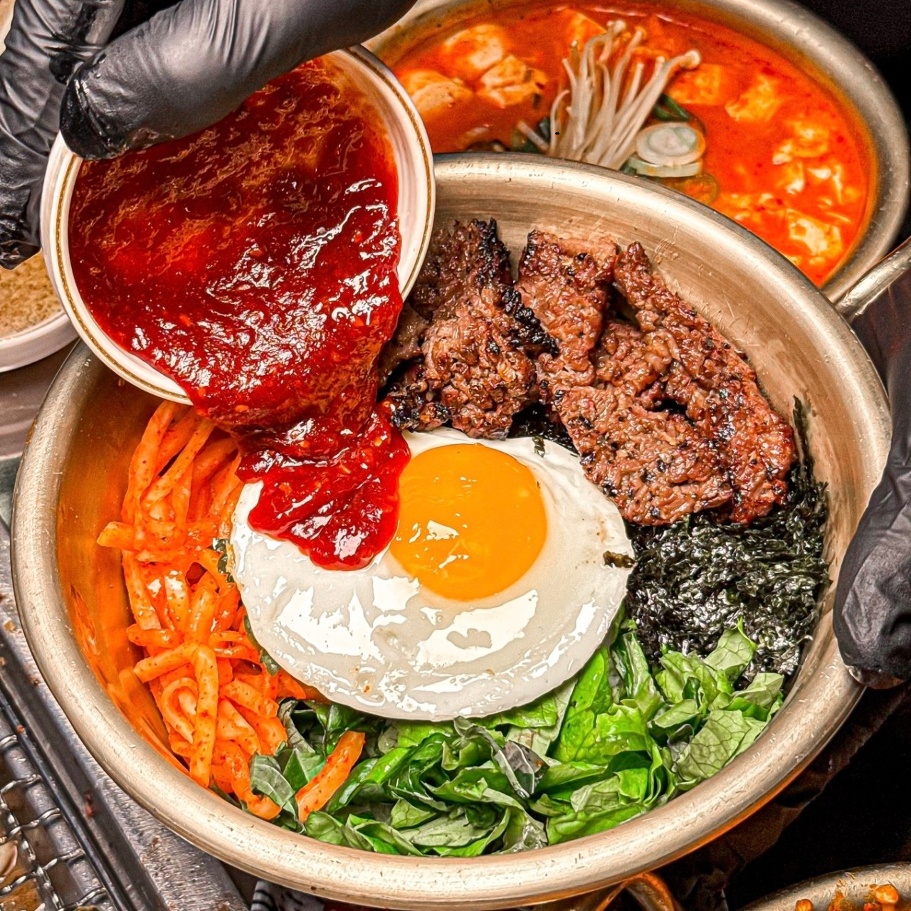 Gangnam Woojeong Premium Galbi grilled short ribs at table