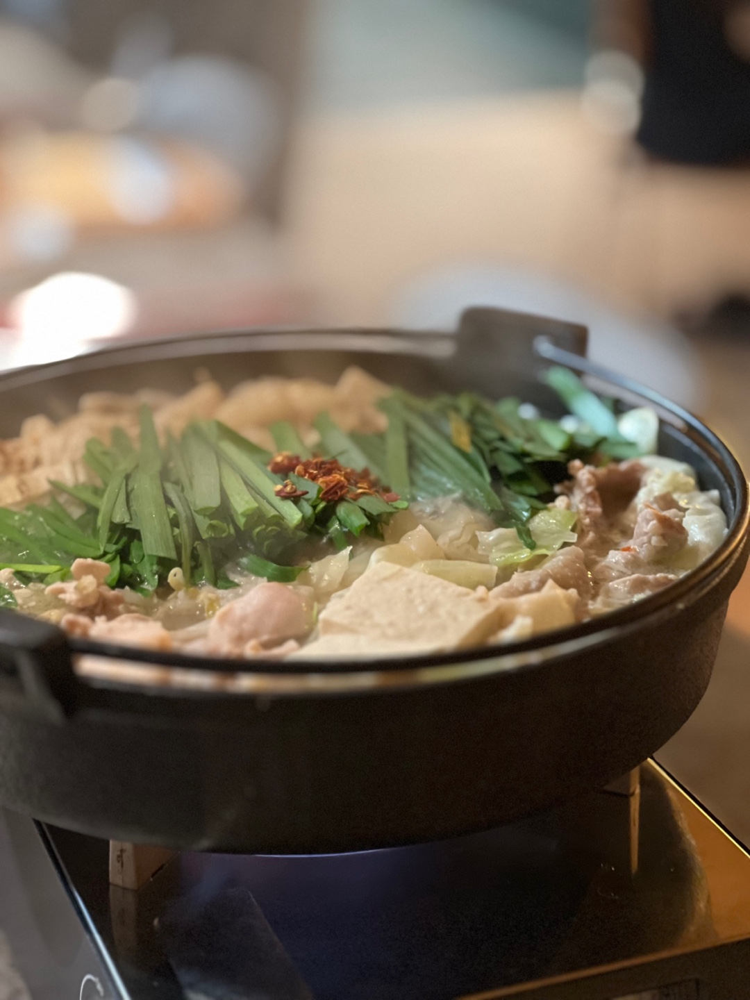 Goraewa izakaya table with nabe and sashimi