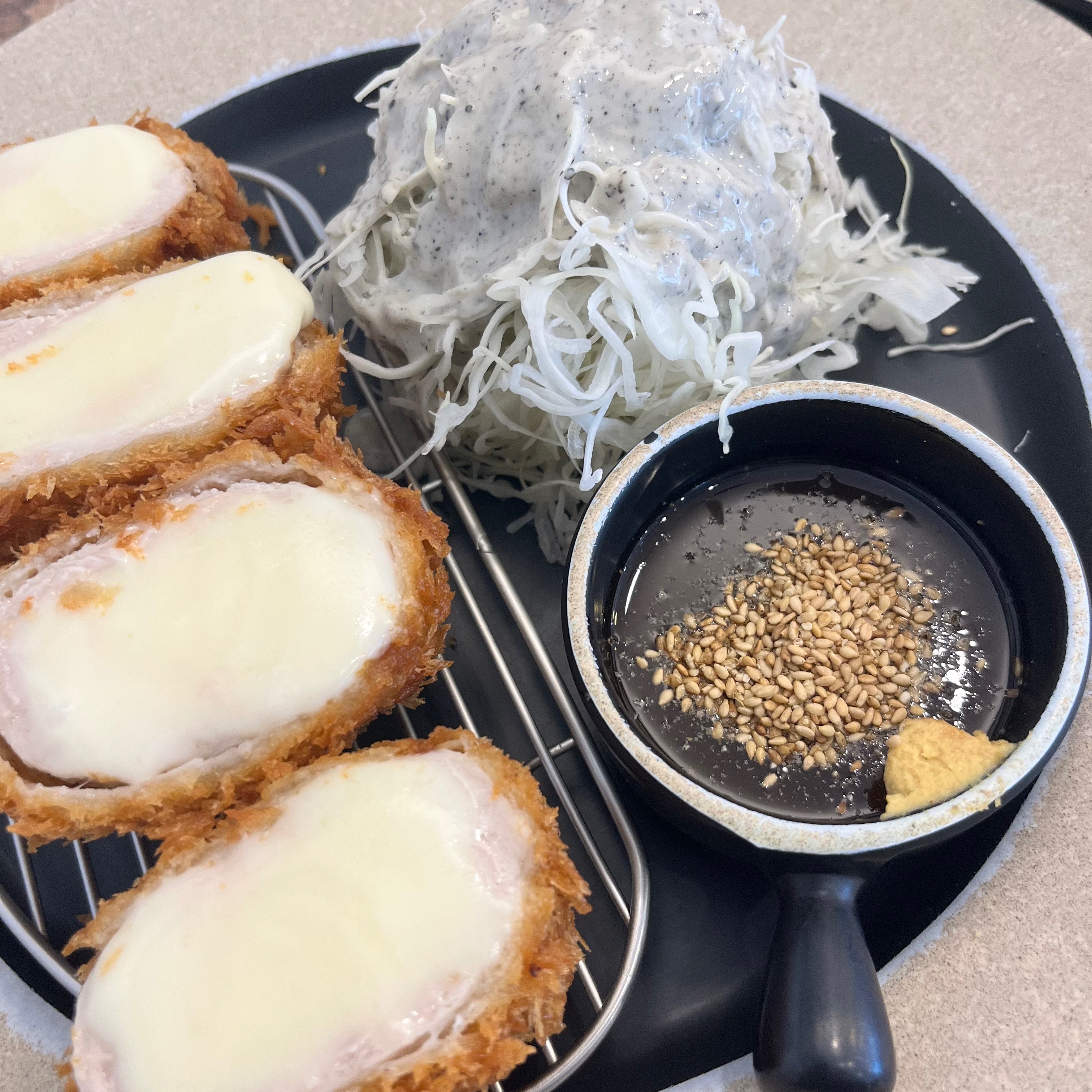 Cheese stuffed donkatsu sliced open with molten center