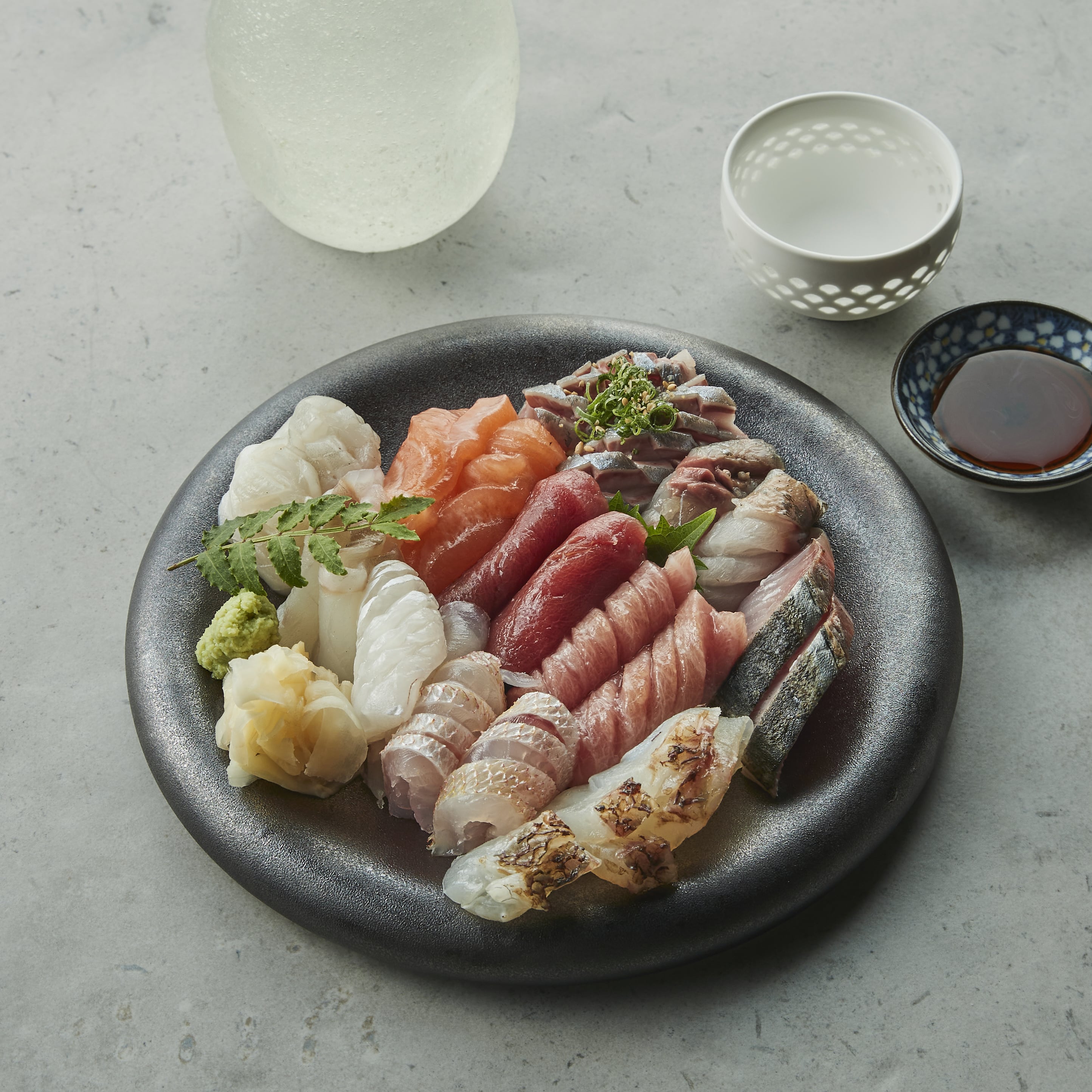 Akaboshi izakaya counter with sushi and sake