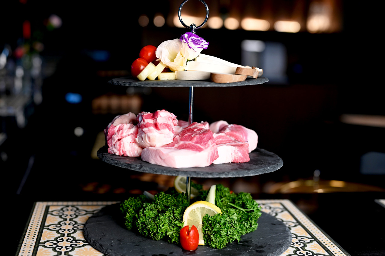 Black Cochon black pork omakase counter with flames