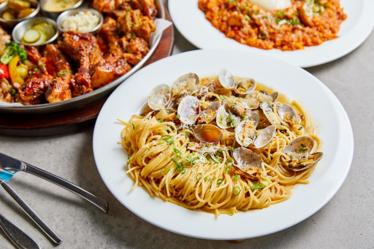 Juven Cuba platters and burgers on a wooden table